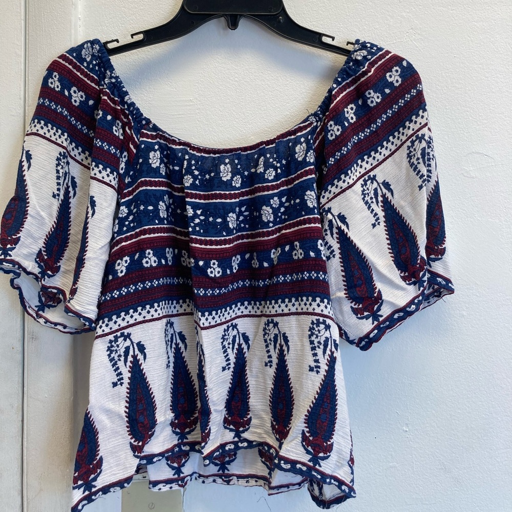 Floral over the shoulder shirt.